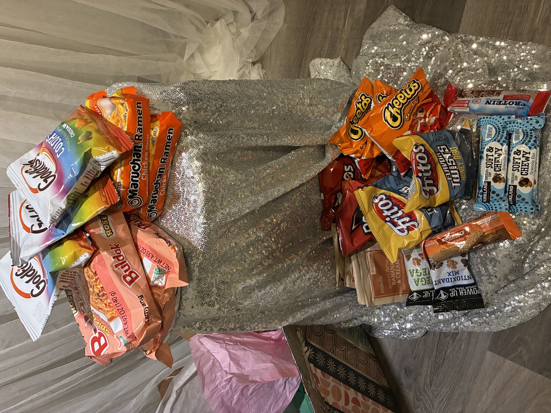 A colorful spread of ramen, chips, oatmeal and granola bars